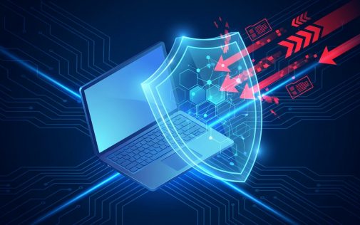 Laptop védelmének illusztrációja kék pajzzsal és piros támadás szimbólumokkal, cybersecurity koncepció.